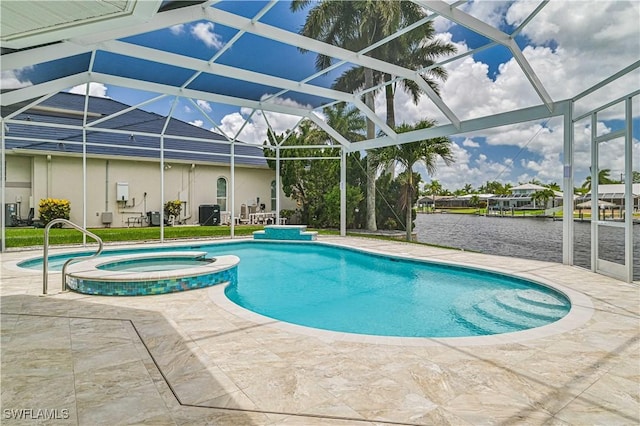 view of pool with glass enclosure, a pool with connected hot tub, and a patio area