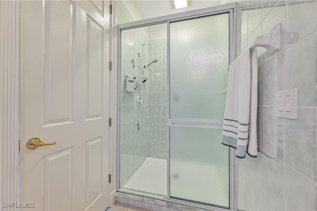 bathroom with a shower stall