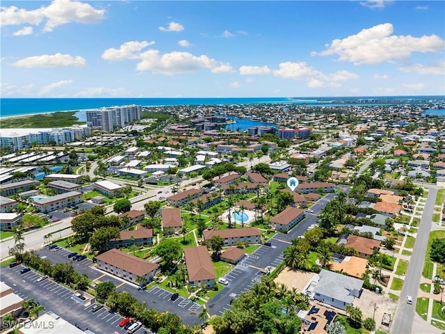 bird's eye view featuring a water view and a view of city