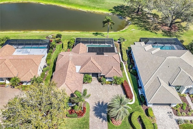 birds eye view of property with a water view