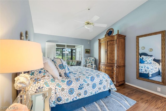 bedroom featuring vaulted ceiling, a ceiling fan, baseboards, and wood finished floors