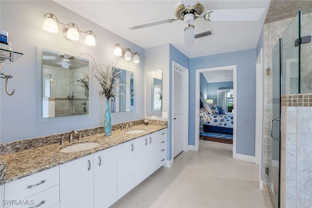 full bath featuring visible vents, a shower stall, and a sink