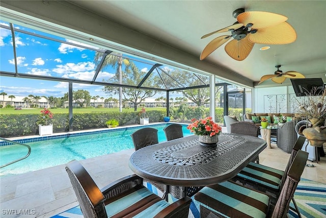 exterior space with a ceiling fan, a lanai, a patio area, and an outdoor living space