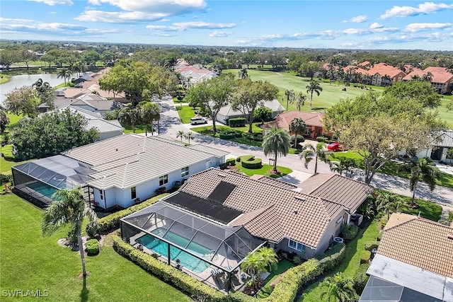 drone / aerial view with a residential view and a water view