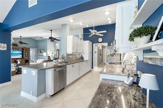 kitchen with dark stone countertops, visible vents, light tile patterned flooring, white cabinets, and appliances with stainless steel finishes