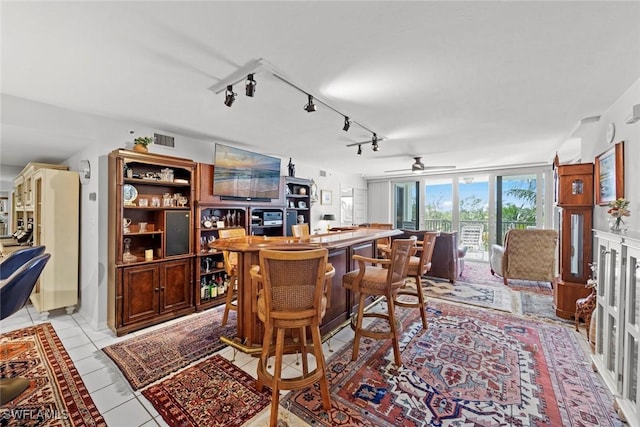 dining room featuring light tile patterned flooring and visible vents