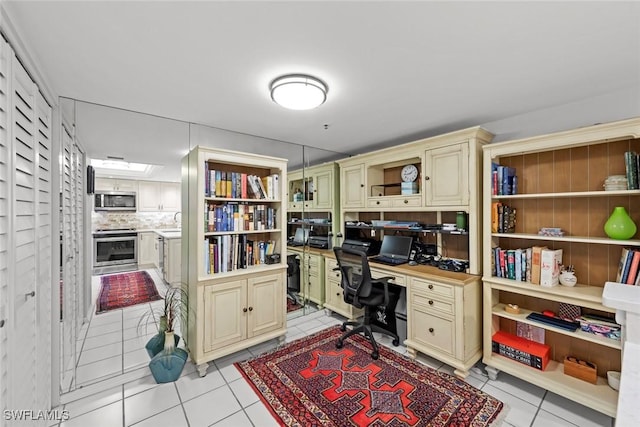 office with a sink and light tile patterned flooring