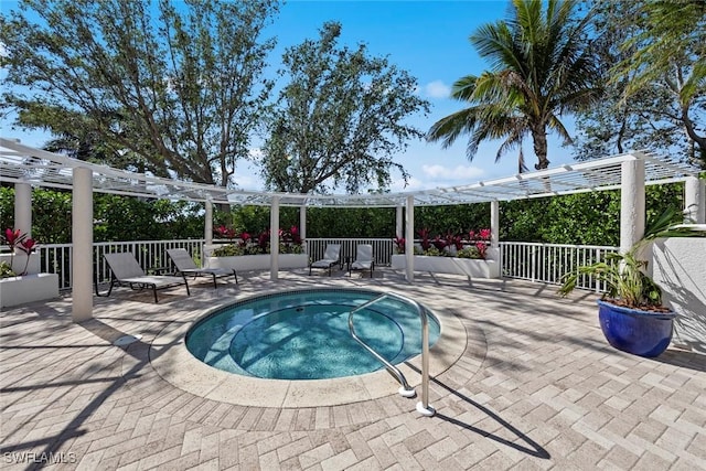 view of swimming pool featuring a patio, a pergola, and a hot tub