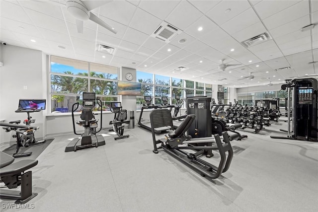 workout area featuring visible vents and a paneled ceiling