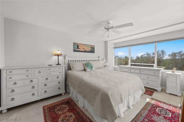 bedroom featuring light tile patterned floors and a ceiling fan