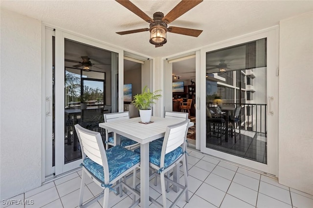 view of patio featuring ceiling fan and outdoor dining space