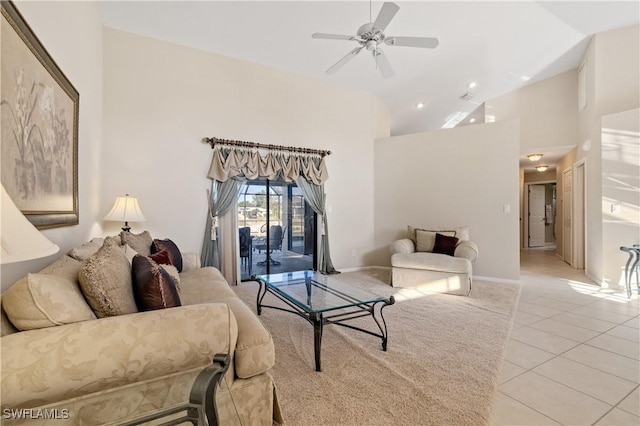 living room featuring baseboards, high vaulted ceiling, ceiling fan, and light tile patterned flooring