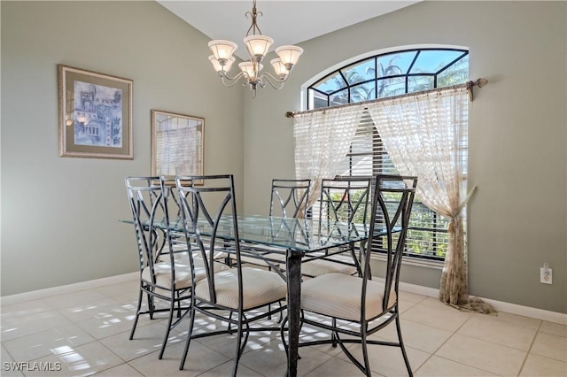 dining space featuring light tile patterned floors, baseboards, and an inviting chandelier