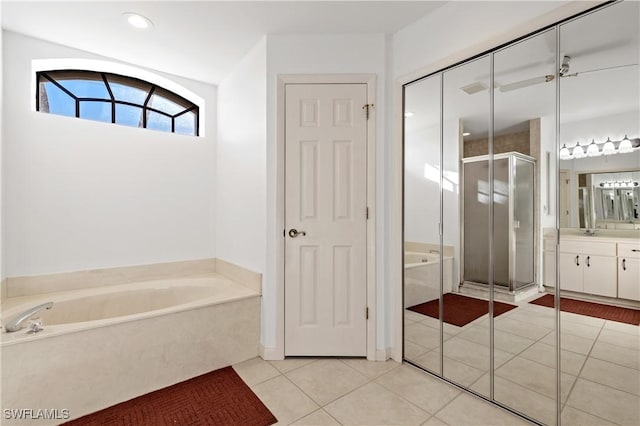 full bathroom with tile patterned floors, a stall shower, vanity, and a bath