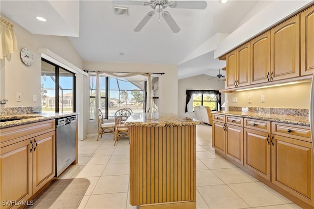 kitchen with a center island, dishwasher, lofted ceiling, light stone counters, and a ceiling fan