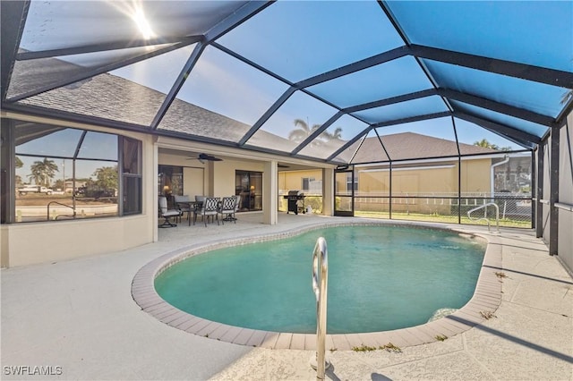 pool featuring a patio, a ceiling fan, and a lanai