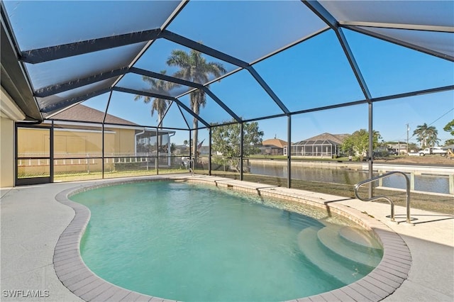 outdoor pool featuring a patio area, a residential view, a lanai, and a water view