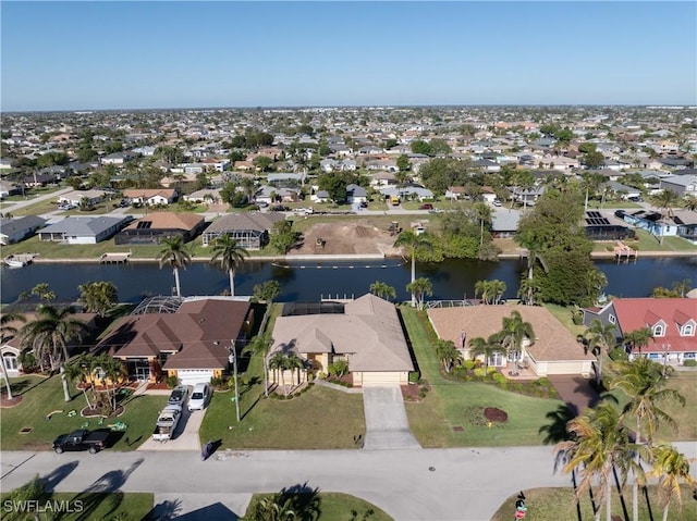 bird's eye view with a residential view and a water view