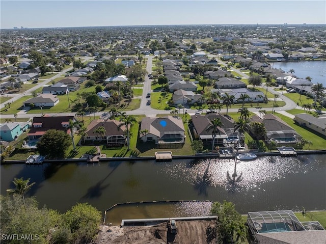 aerial view with a residential view and a water view