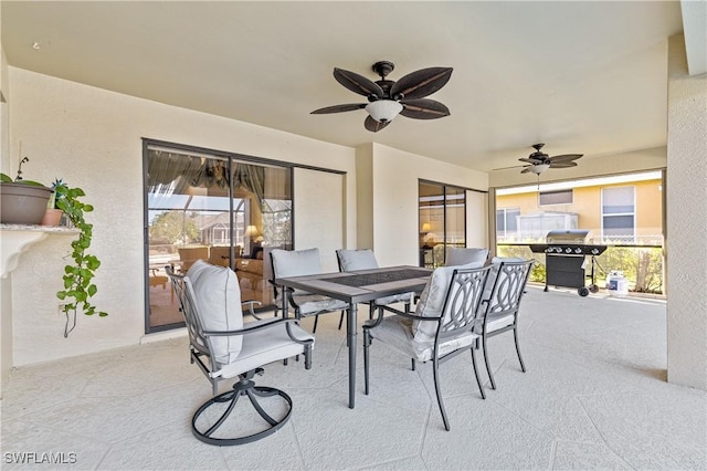 view of patio / terrace with outdoor dining area, grilling area, and a ceiling fan