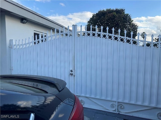 view of gate featuring fence