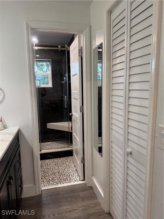 hallway featuring dark wood-style floors