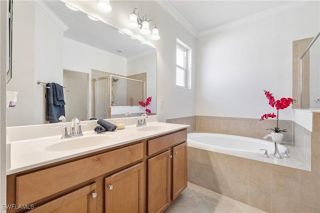 full bathroom with a stall shower, a sink, crown molding, a bath, and tile patterned floors