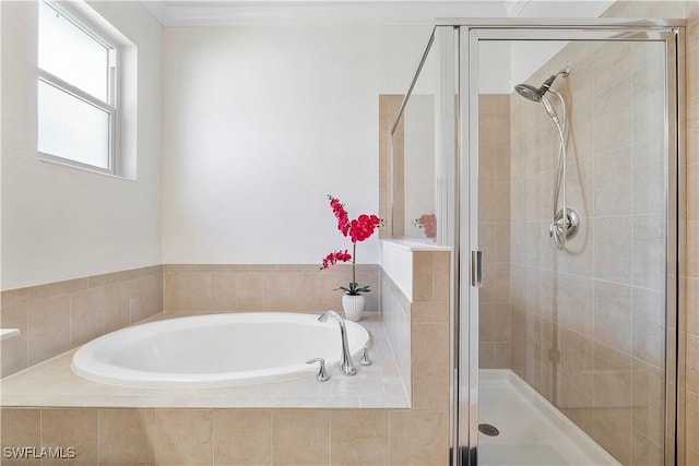 bathroom with a bath and a shower stall