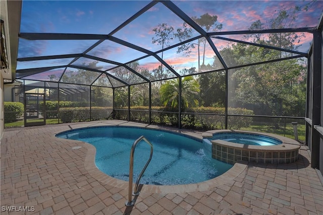 10432 Yorkstone Dr, Bonita Springs, FL 34135 - pool at dusk with a pool with connected hot tub and a patio area