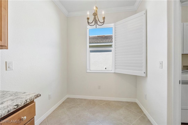 unfurnished dining area with a notable chandelier, crown molding, and baseboards