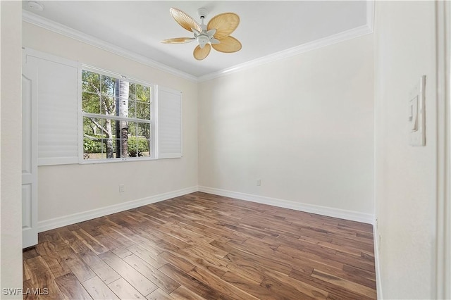 unfurnished room with crown molding, wood finished floors, baseboards, and ceiling fan