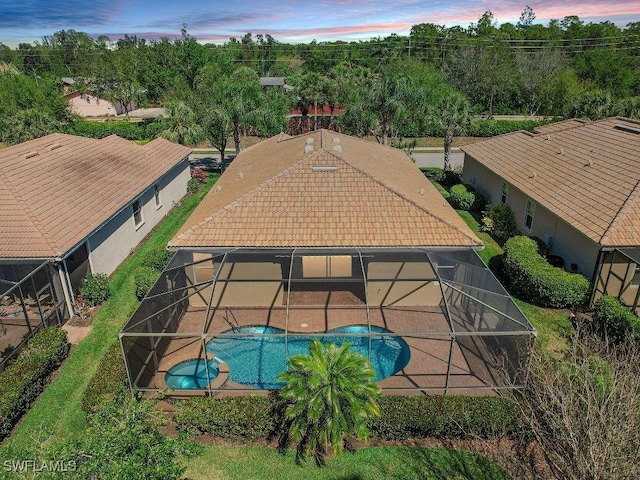 10432 Yorkstone Dr, Bonita Springs, FL 34135 - view of swimming pool featuring a lanai, a patio area, and a pool with connected hot tub
