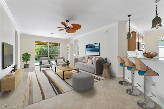 10432 Yorkstone Dr, Bonita Springs, FL 34135 - living area featuring arched walkways, crown molding, ceiling fan, and light tile patterned floors