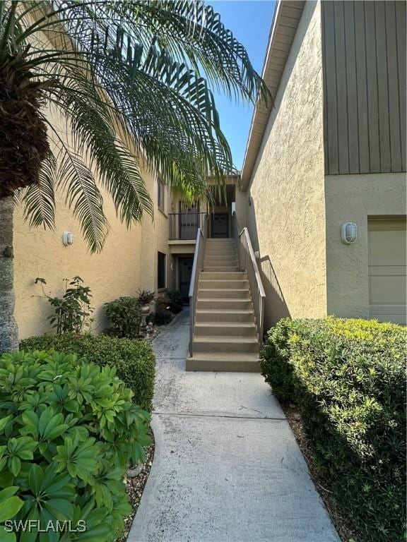 view of exterior entry featuring stucco siding