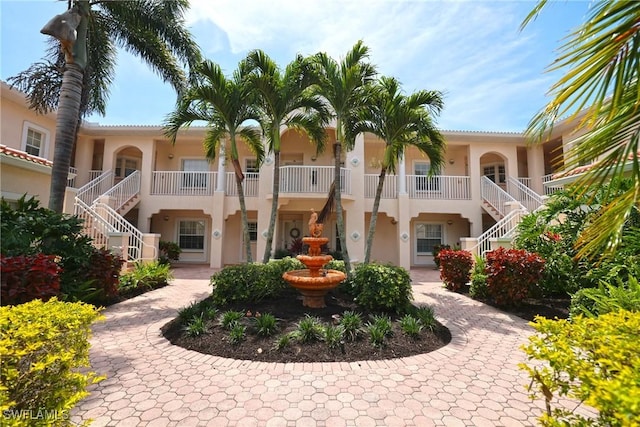 view of property featuring stairway