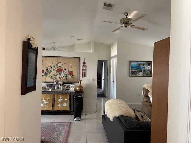 interior space with visible vents and lofted ceiling