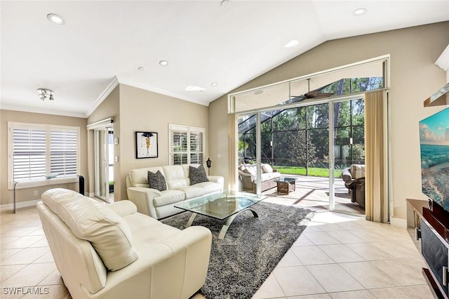 living area featuring light tile patterned floors, baseboards, crown molding, and vaulted ceiling