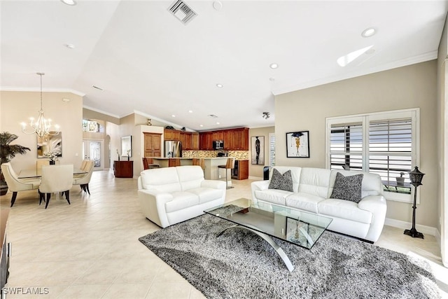 living area featuring a wealth of natural light, visible vents, an inviting chandelier, crown molding, and vaulted ceiling