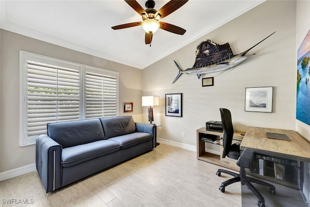 office space with crown molding, baseboards, ceiling fan, lofted ceiling, and wood finished floors