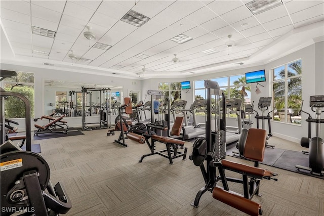 workout area featuring visible vents, baseboards, and carpet