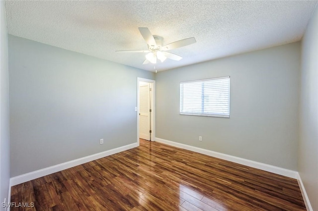 empty room featuring ceiling fan, a textured ceiling, baseboards, and wood finished floors