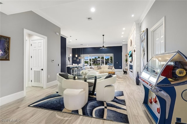 dining area featuring visible vents, recessed lighting, crown molding, light wood finished floors, and baseboards