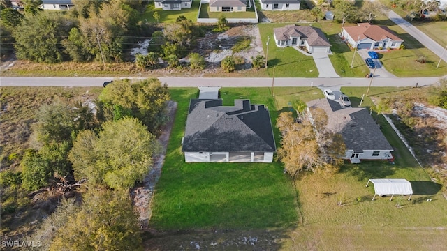 birds eye view of property with a residential view