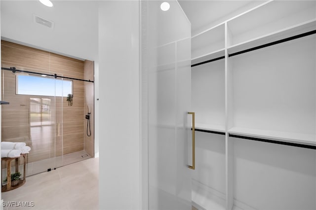 bathroom featuring visible vents and walk in shower