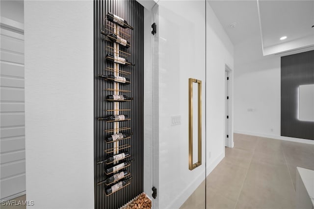 interior space featuring tile patterned floors, baseboards, and recessed lighting