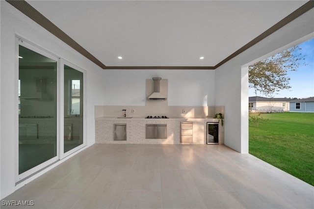 view of patio / terrace featuring wine cooler and an outdoor kitchen