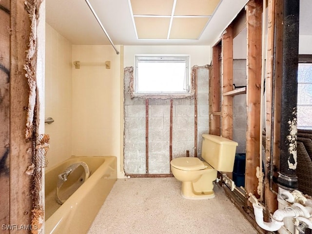 bathroom with toilet and shower / bath combination