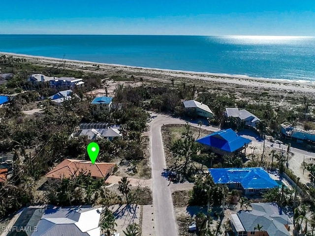 aerial view with a view of the beach and a water view