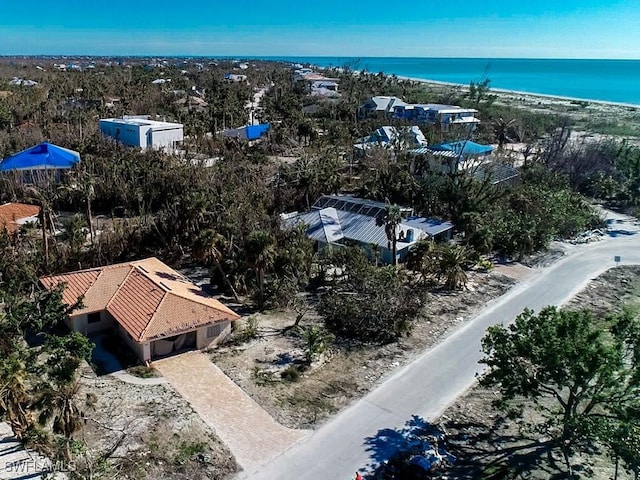 bird's eye view with a view of the beach and a water view