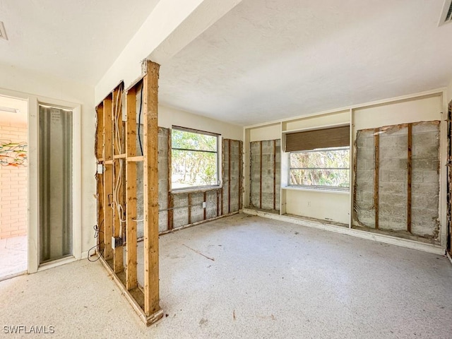 unfurnished room with visible vents